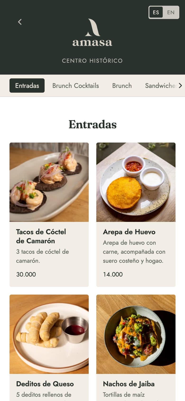 Menú digital de Amasa en un celular, con fotos de los platos y precios